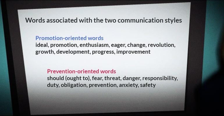Slide displaying two paragraphs: one highlighting 'promotion-oriented' words and the other focusing on 'prevention-oriented' terms.