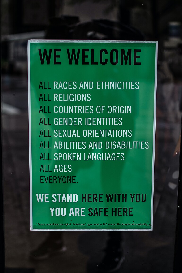 Green poster for inclusiveness.