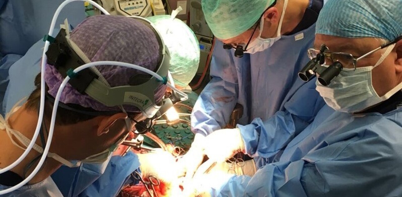 Four surgeons operating.