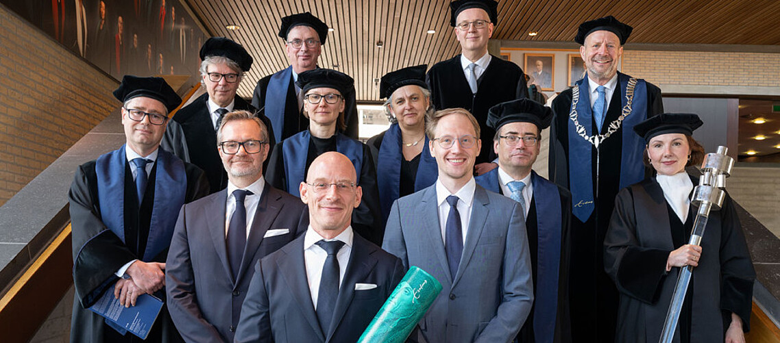 Newly-minted PhD, Dr Florian Madertoner (front, centre), and the PhD promoters and Doctoral Committee