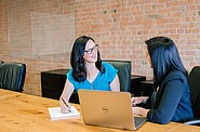 Two women talking to each other