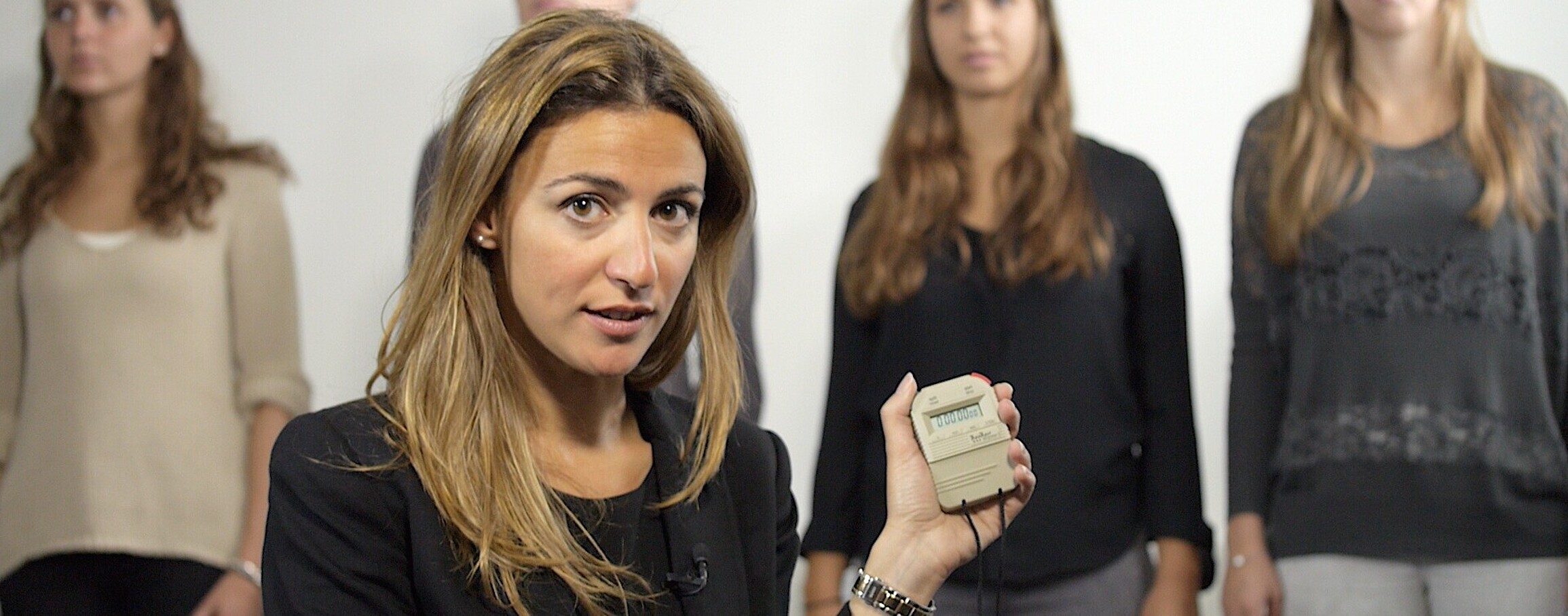 a woman holding a stopwatch