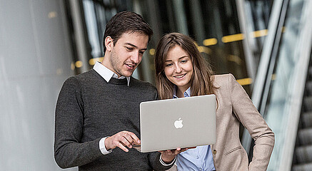 Students looking at computer