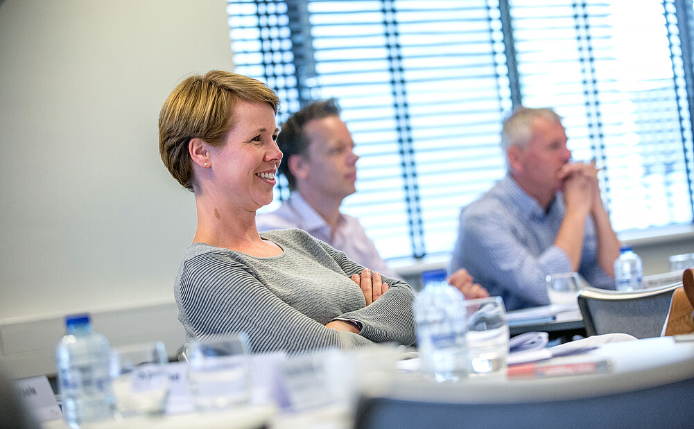 Participants smiling in the classroom