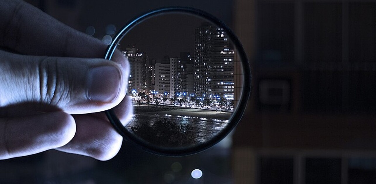 City night skyline through a lens