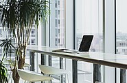 a laptop on an empty desk