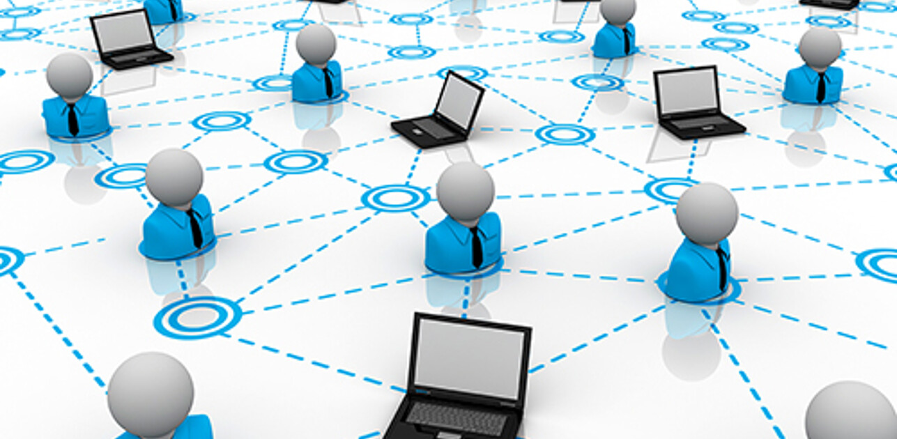 A network illustration of numerous laptops linked together with lines, interspersed with human figures, symbolizing global digital connectivity.