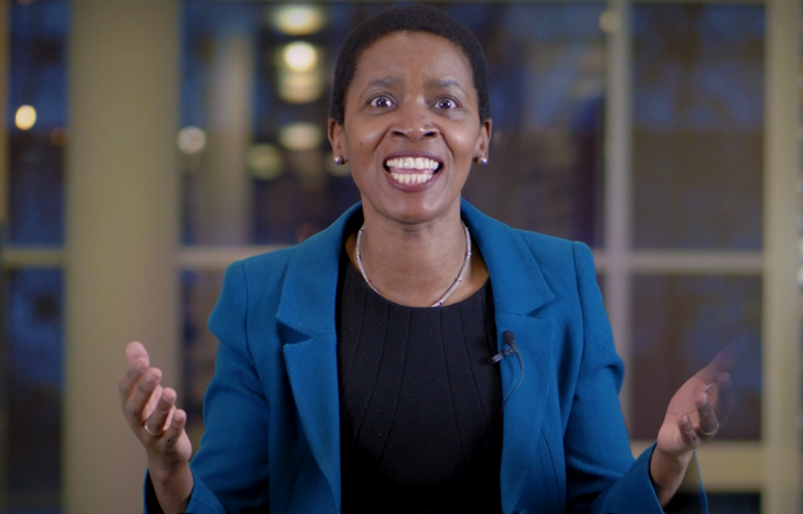 A woman explaining the leading change programme