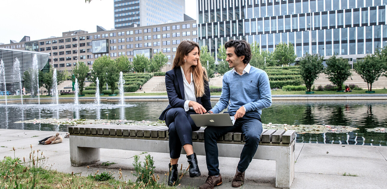 Student–Advisor Conversation by the Pond at Erasmus University Rotterdam