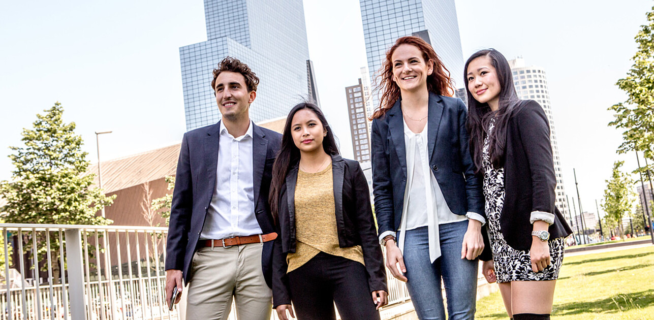 4 students standing next to each other