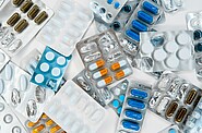 Assorted blister packs of generic medicines, many of them partly or completely empty, illustrating concerns about medicine shortages.