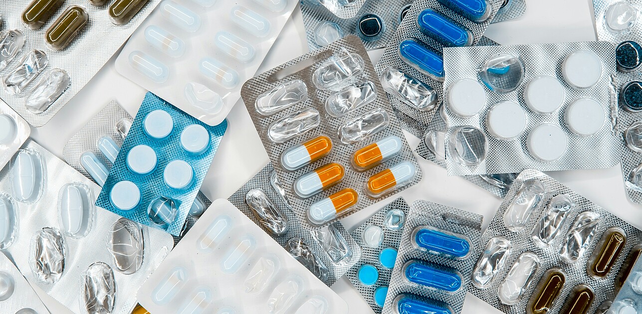 Assorted blister packs of generic medicines, many of them partly or completely empty, illustrating concerns about medicine shortages.