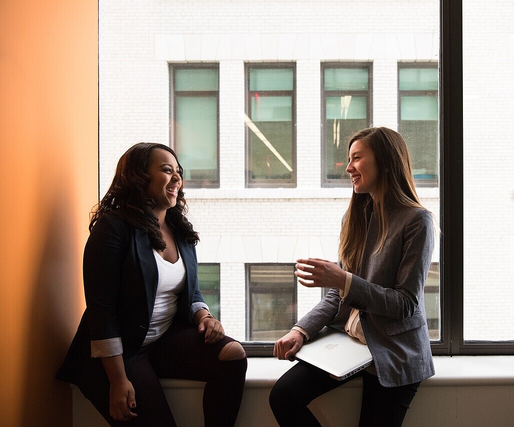 Two women talking to each other