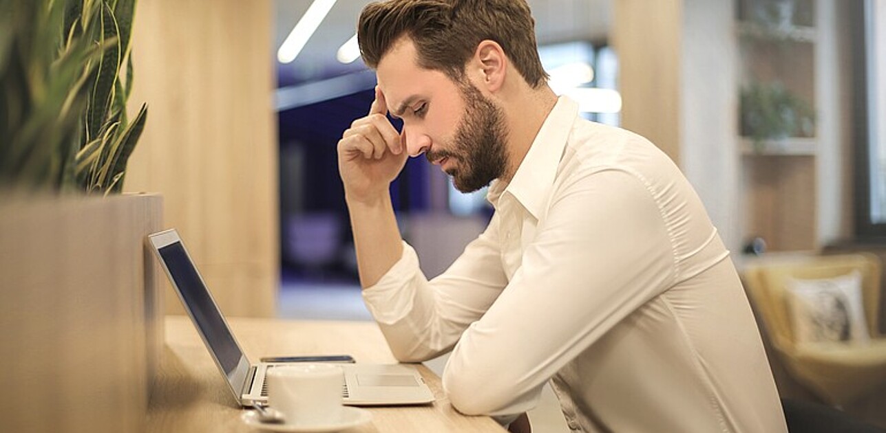 Man sitting in front of computer