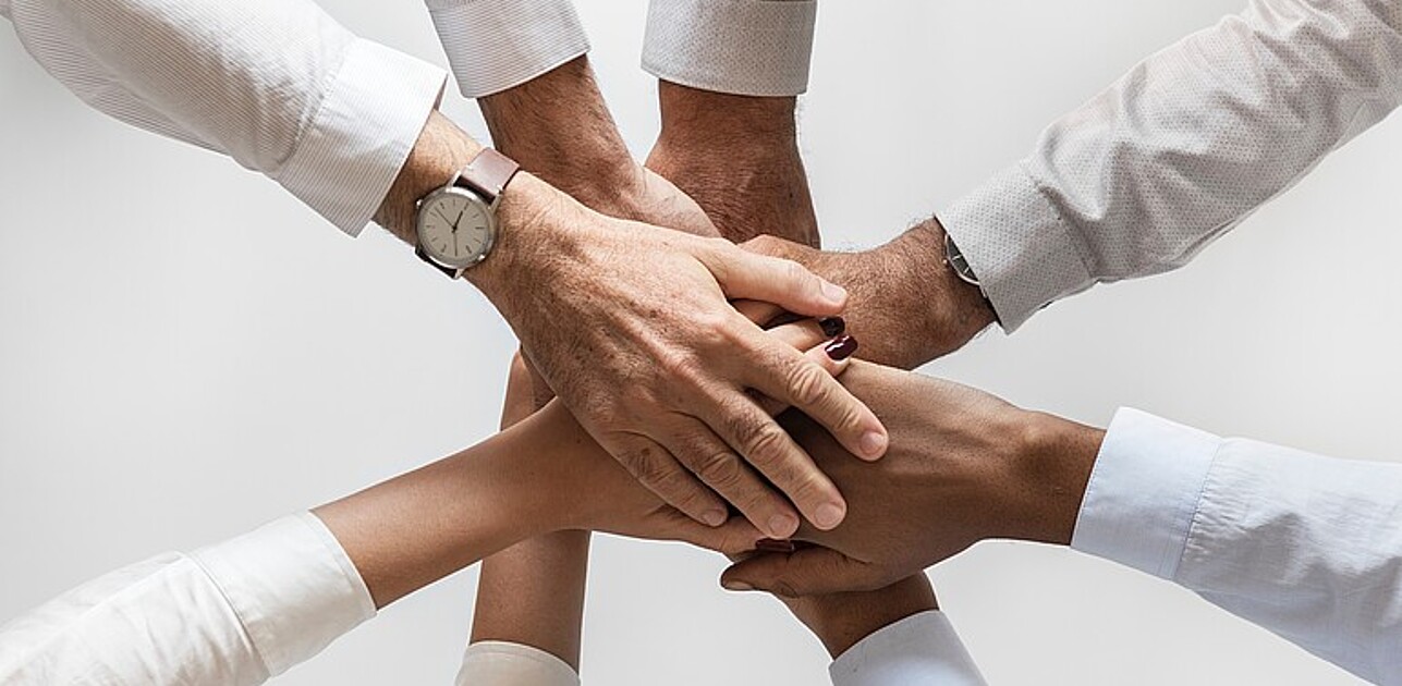 Hands touching in a circle