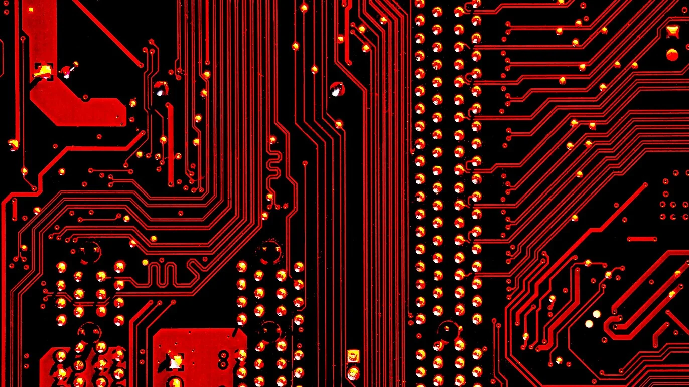 An image shows red circuit board of computer