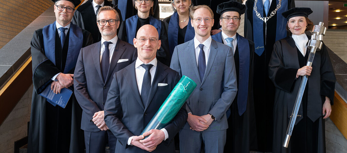 Newly-minted PhD, Dr Florian Madertoner (front, centre), and the PhD promoters and Doctoral Committee