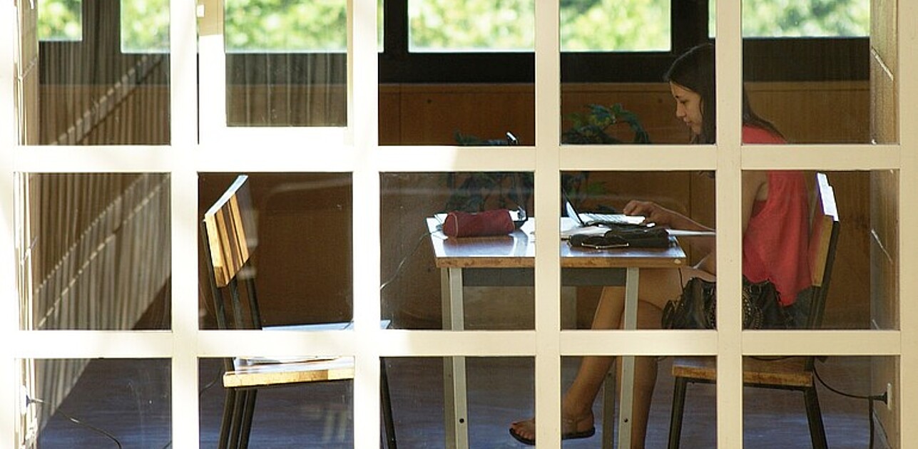 Girl in school on laptop