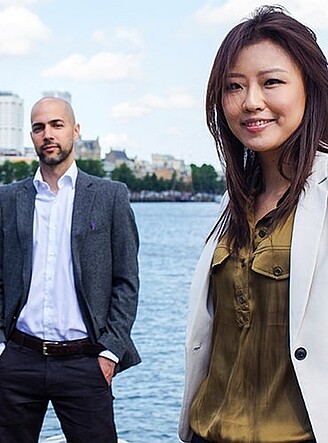 Business students standing in front of body of water in Rotterdam