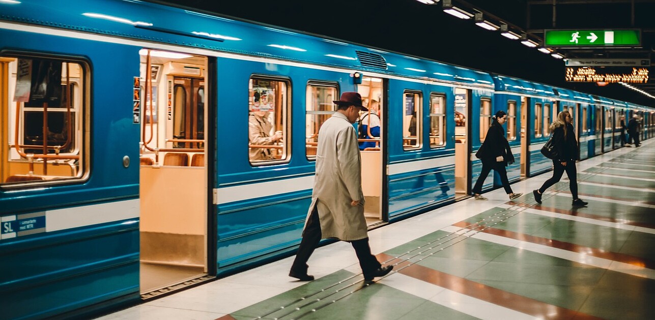 People coming in and out of a metro