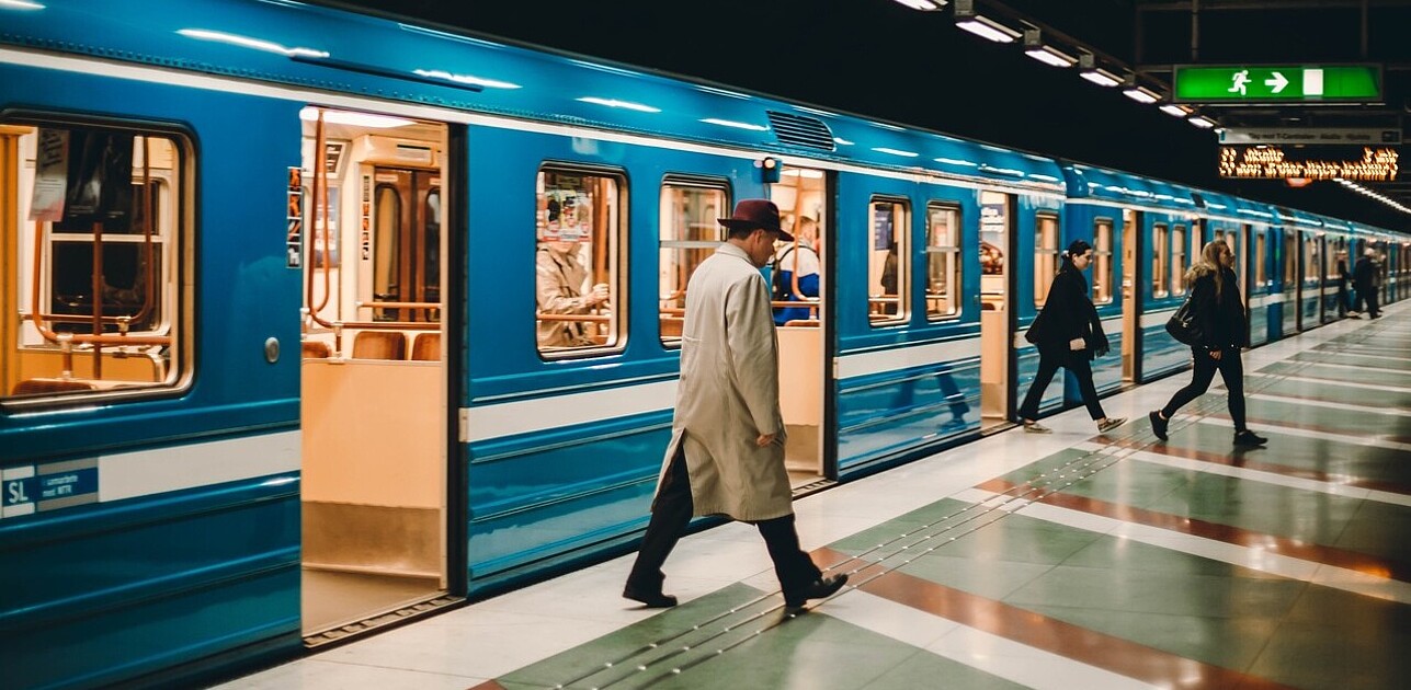 People coming in and out of a metro