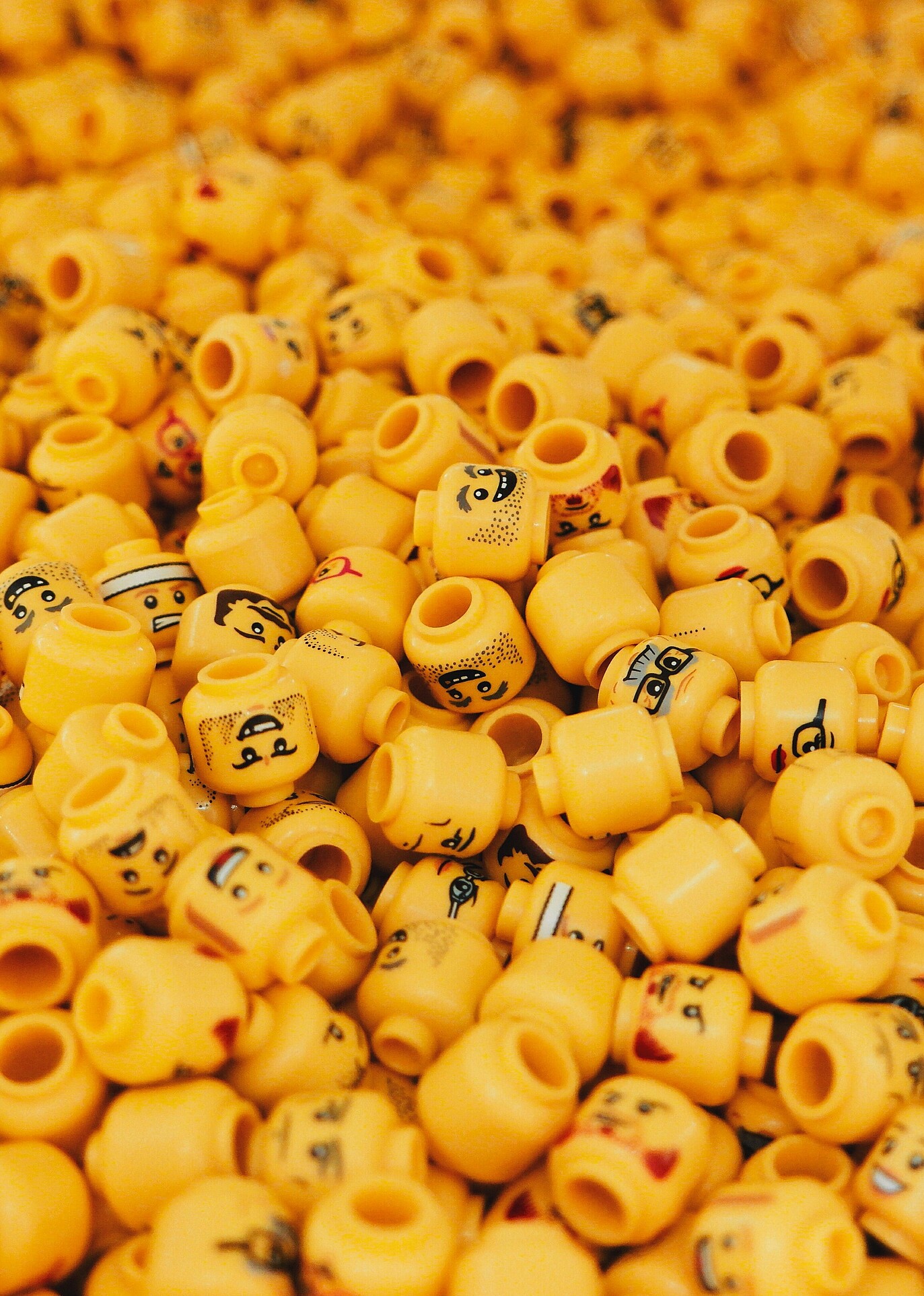Endless sea of unique Lego heads, each with distinct features and expressions, illustrating the concept of individuality amidst uniformity.