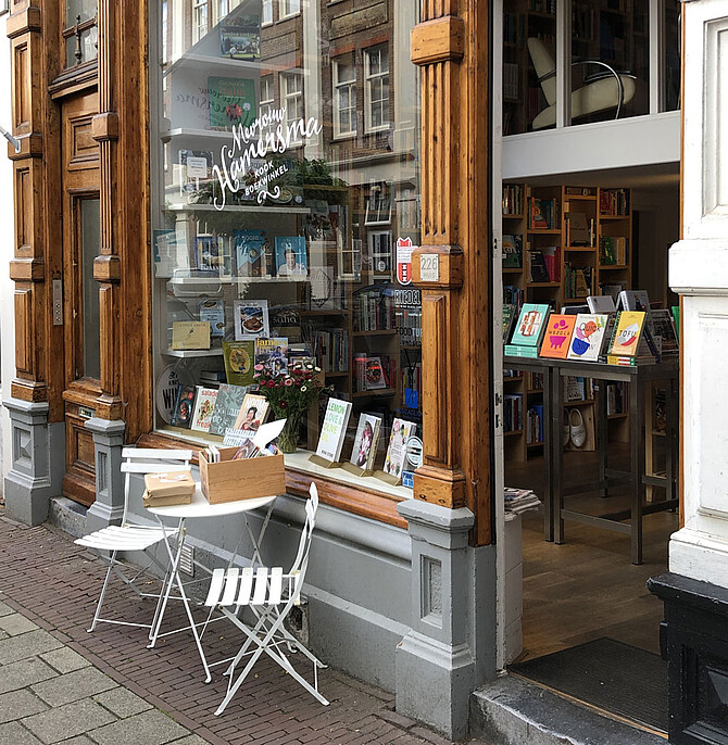 Photo shows shop window of Mw. Hamersma with books