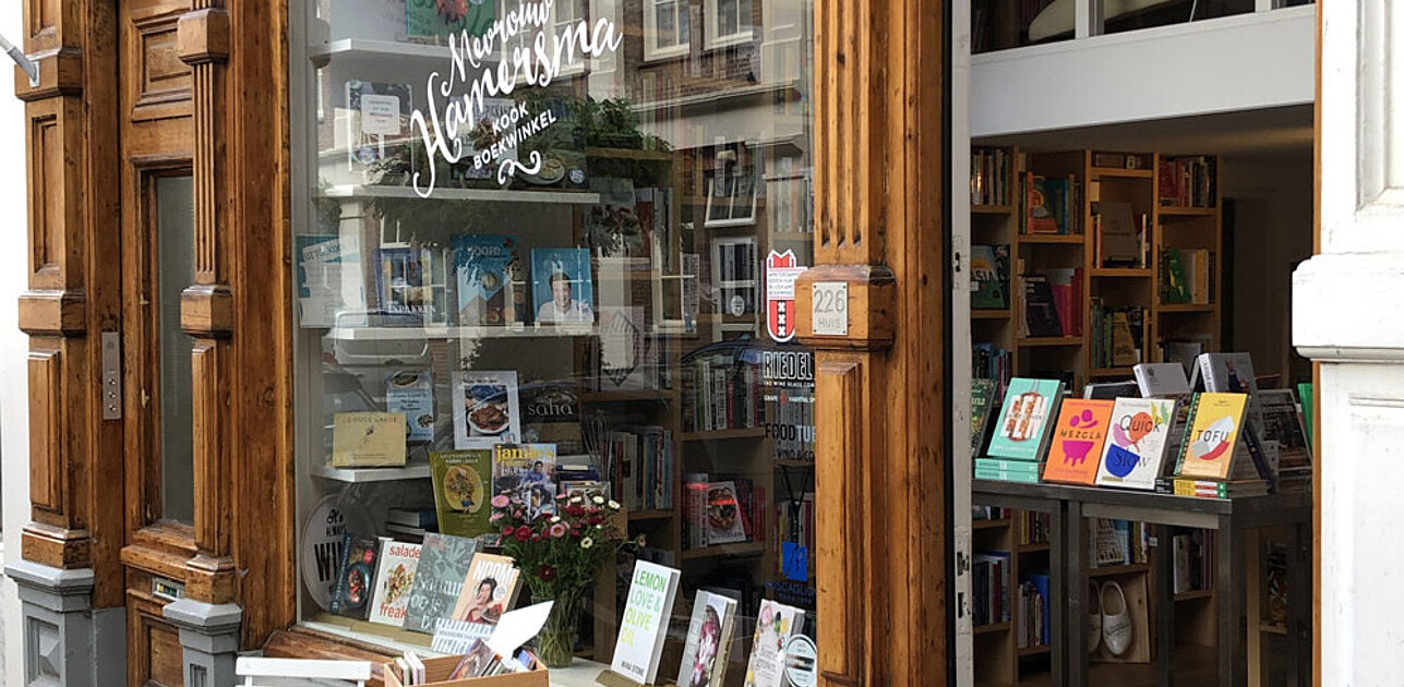 Photo shows shop window of Mw. Hamersma with books