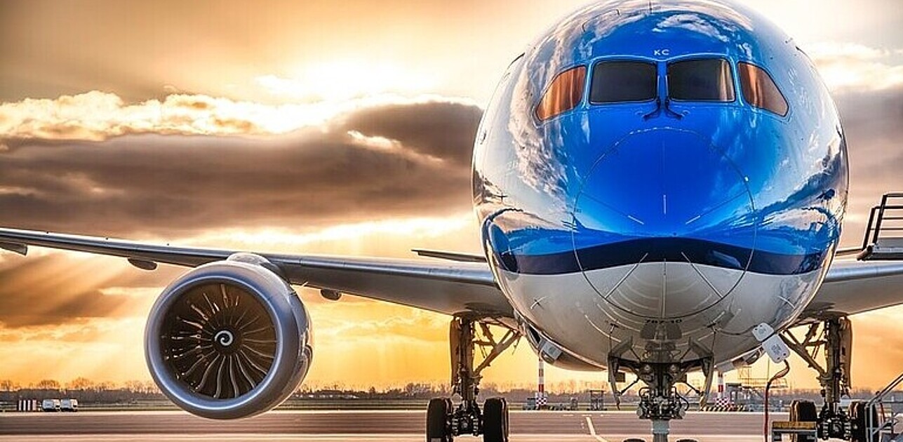 Airplane in front of sunset