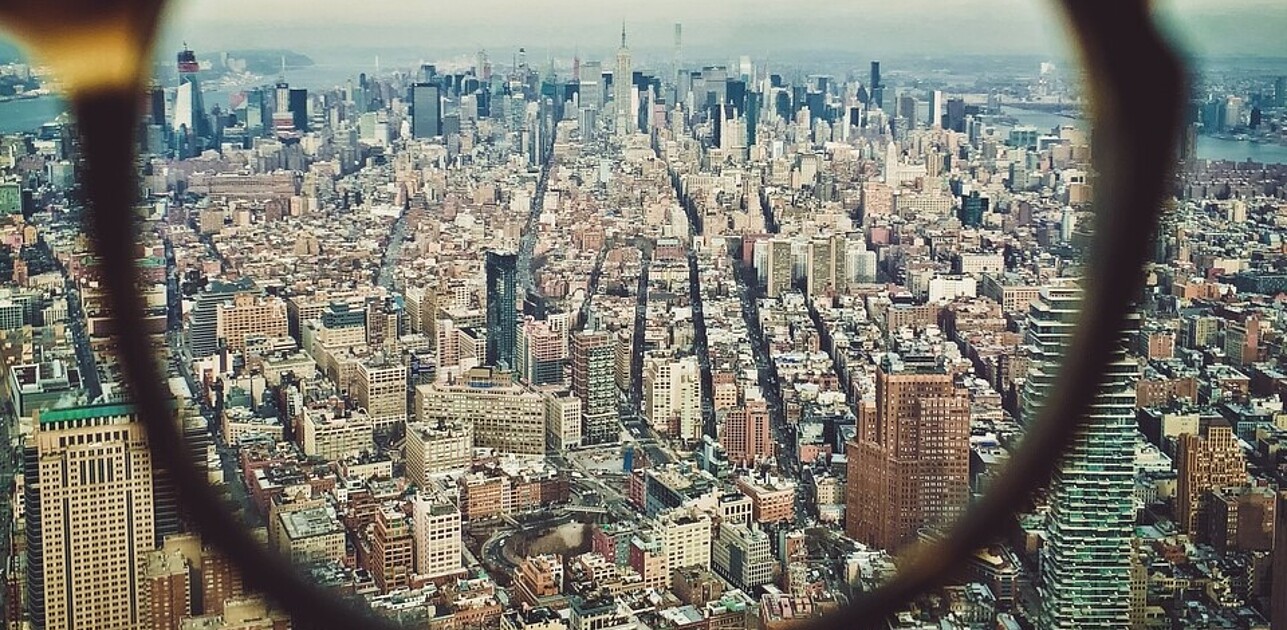 looking through at a city through glasses