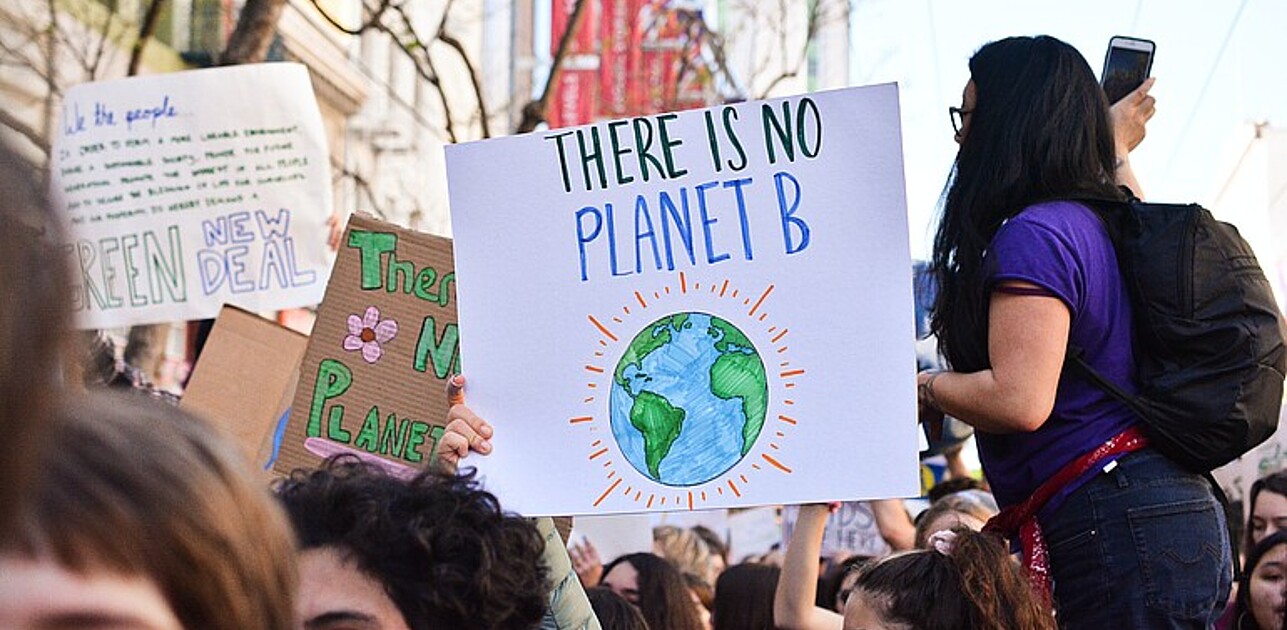 Protestors holding up the sign: "There is no planet B"