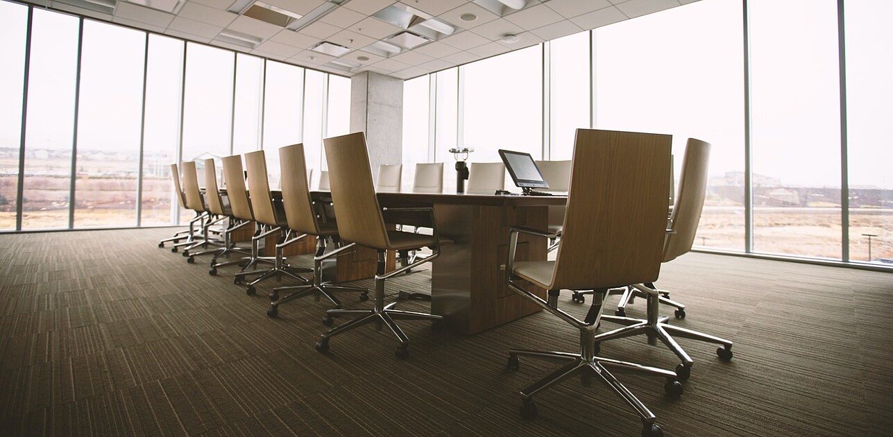 a boardroom with empty chairs