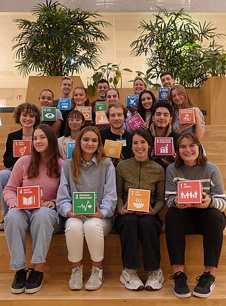 Image featuring a group of enthusiastic individuals from various backgrounds, collaborating on projects to promote sustainable development goals and drive positive change. Clicking will lead to the page "RSM SDG ambassadors programme" 