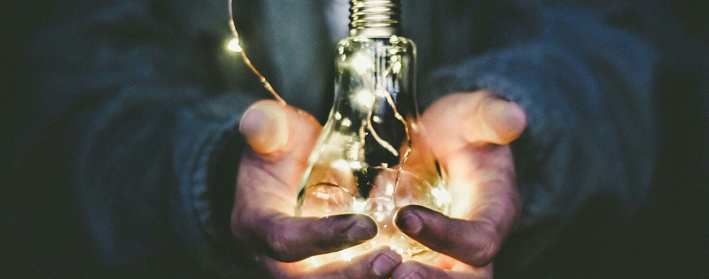 Man with lightbulb in hands