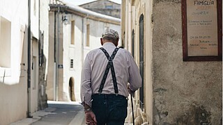 Pensioner, walking away