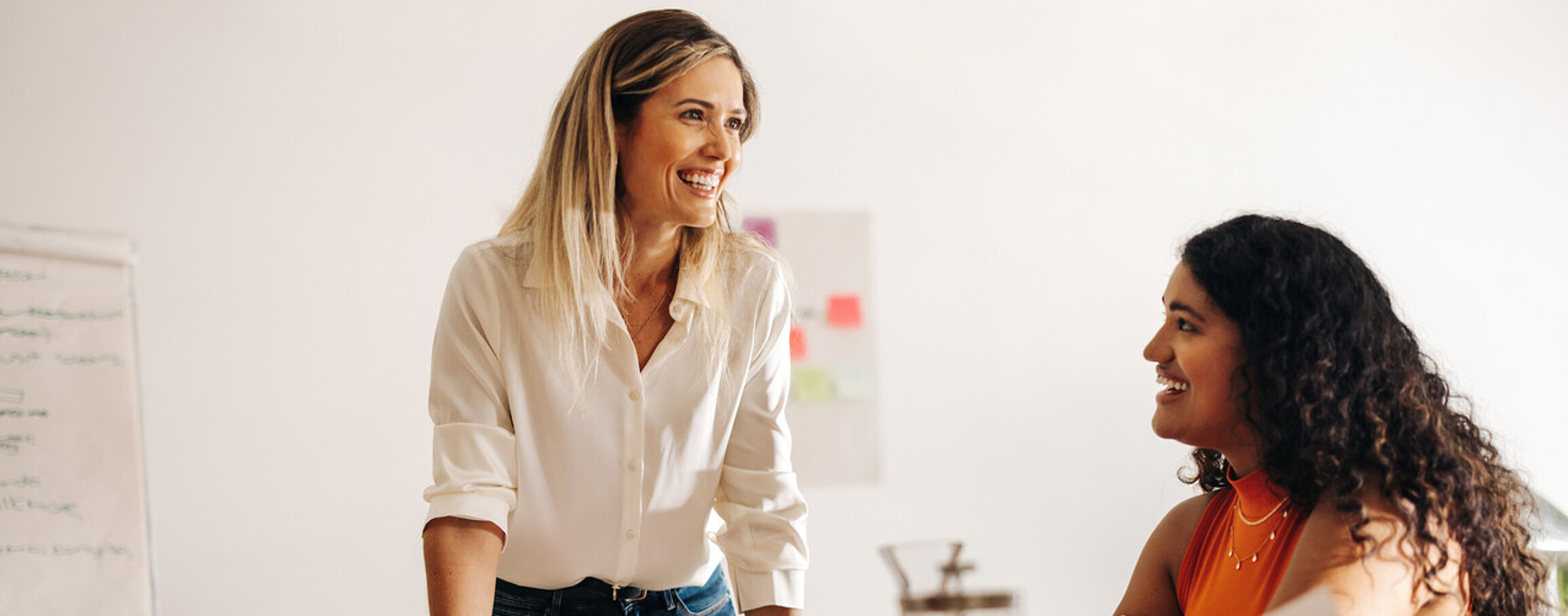 Image of a passionate leader enthusiastically brainstorming with her engaged team, radiating positivity and collaboration.