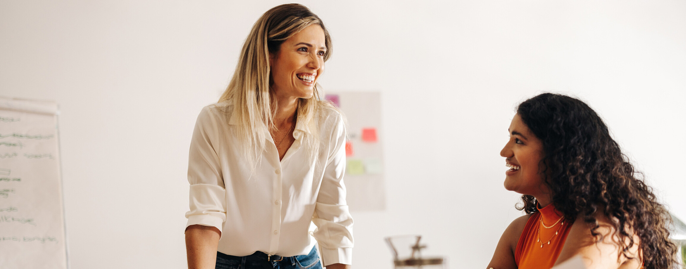 Image of a passionate leader enthusiastically brainstorming with her engaged team, radiating positivity and collaboration.