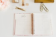 Open notebook displaying handwritten personal goals on its pages.